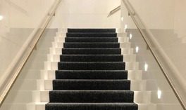 carpeted stairway in an apartment complex