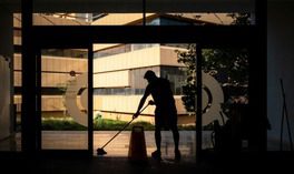 employee mopping entrance